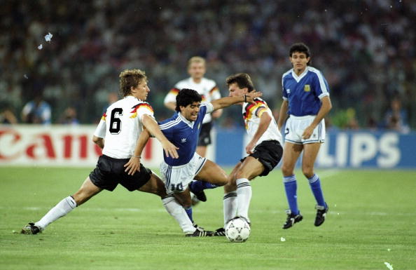 Diego Maradona of Argentina, Guido Buchwald and Lothar Mattheus of West Germany