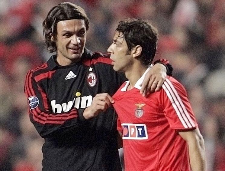 Benfica's Rui Costa talks with AC Milan's Maldini at the end of their Champions League match in Lisbon