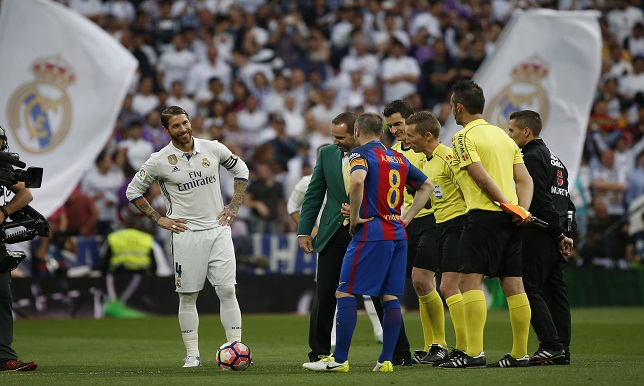 Real Madrid's Sergio Ramos and Barcelona's Andres Iniesta with golfer Sergio Garcia and officials before the match