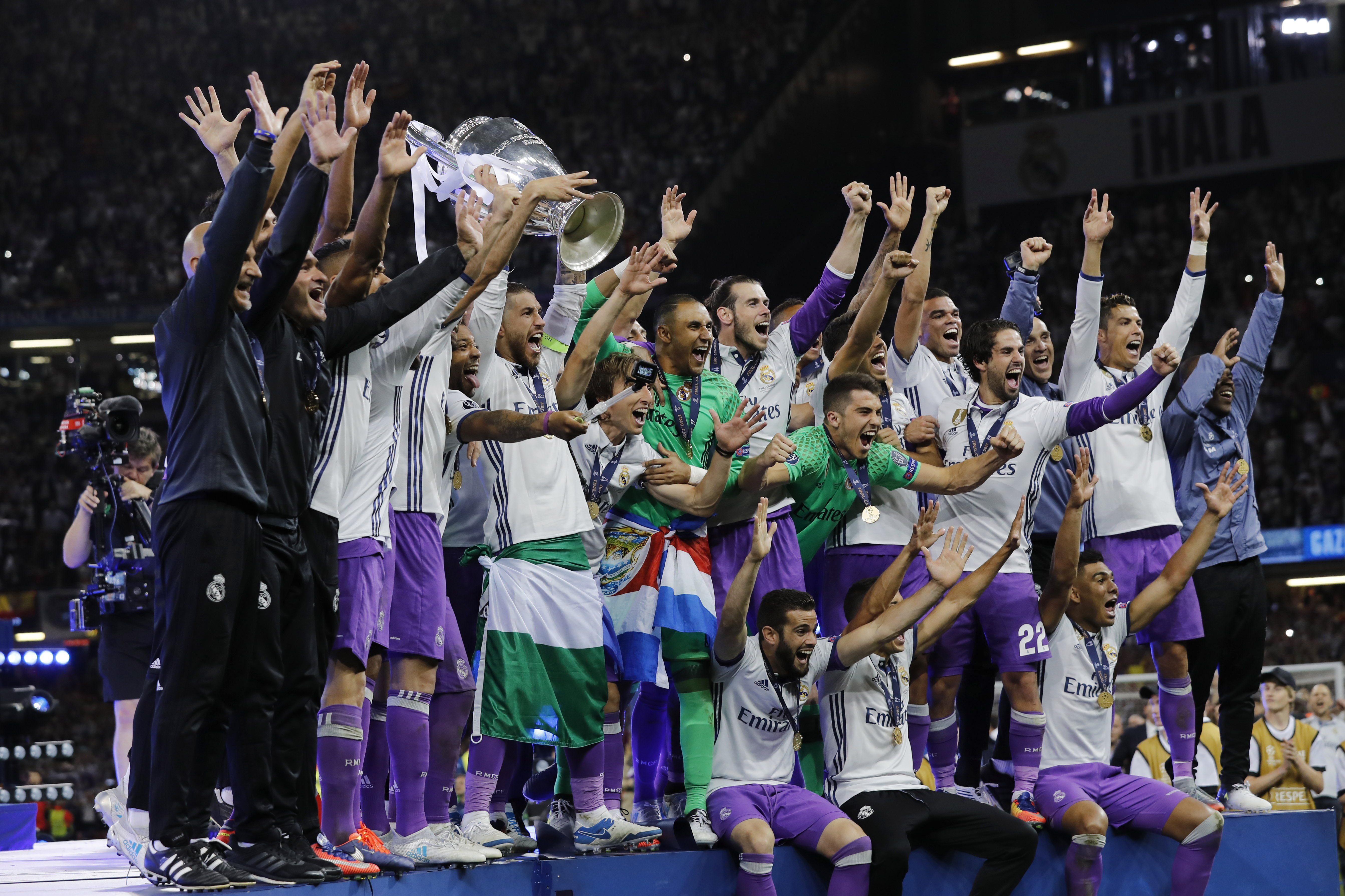 Real Madrid celebrate with the trophy after winning the UEFA Champions League Final