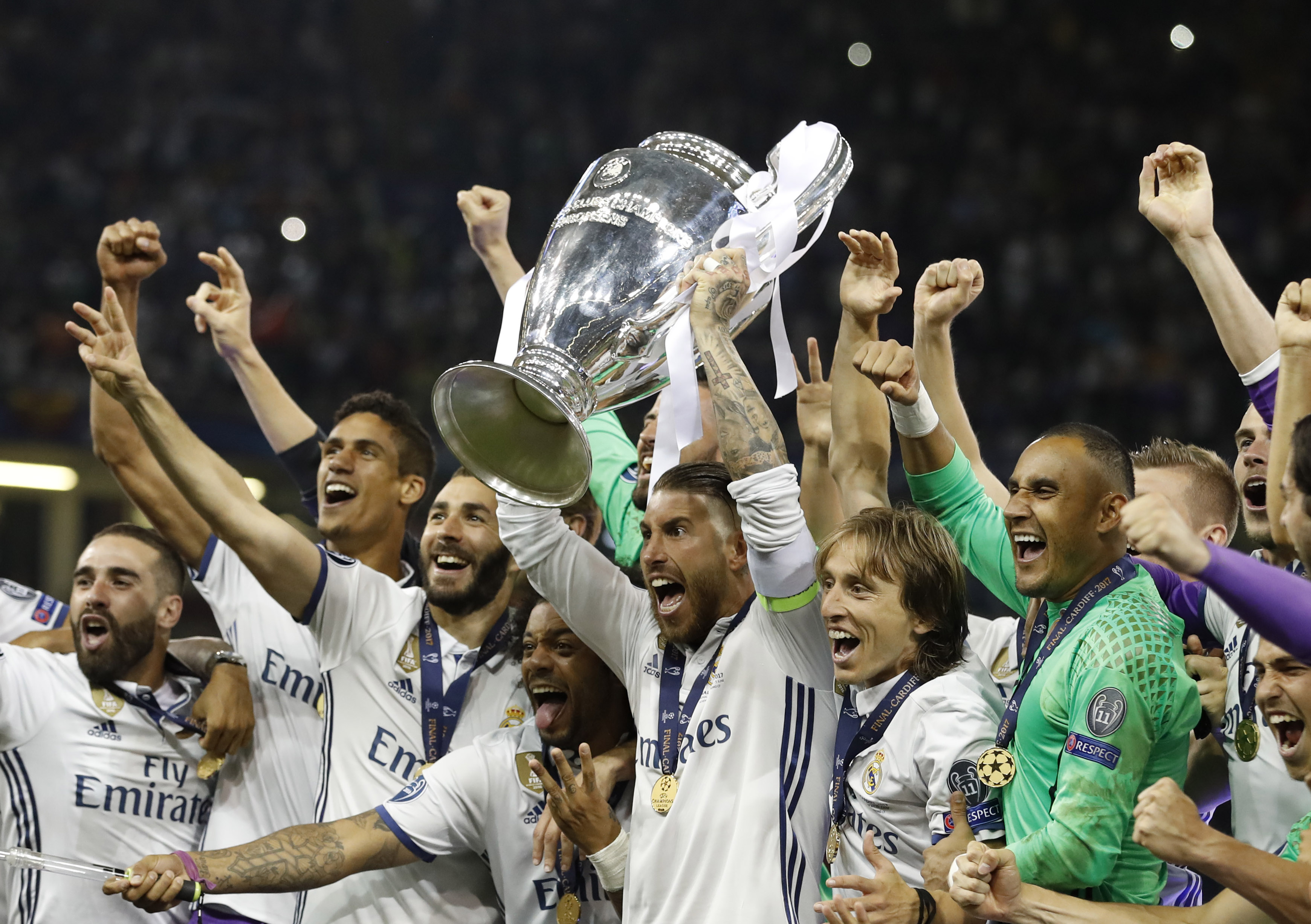 Real Madrid's Sergio Ramos celebrates with the trophy after winning the UEFA Champions League Final