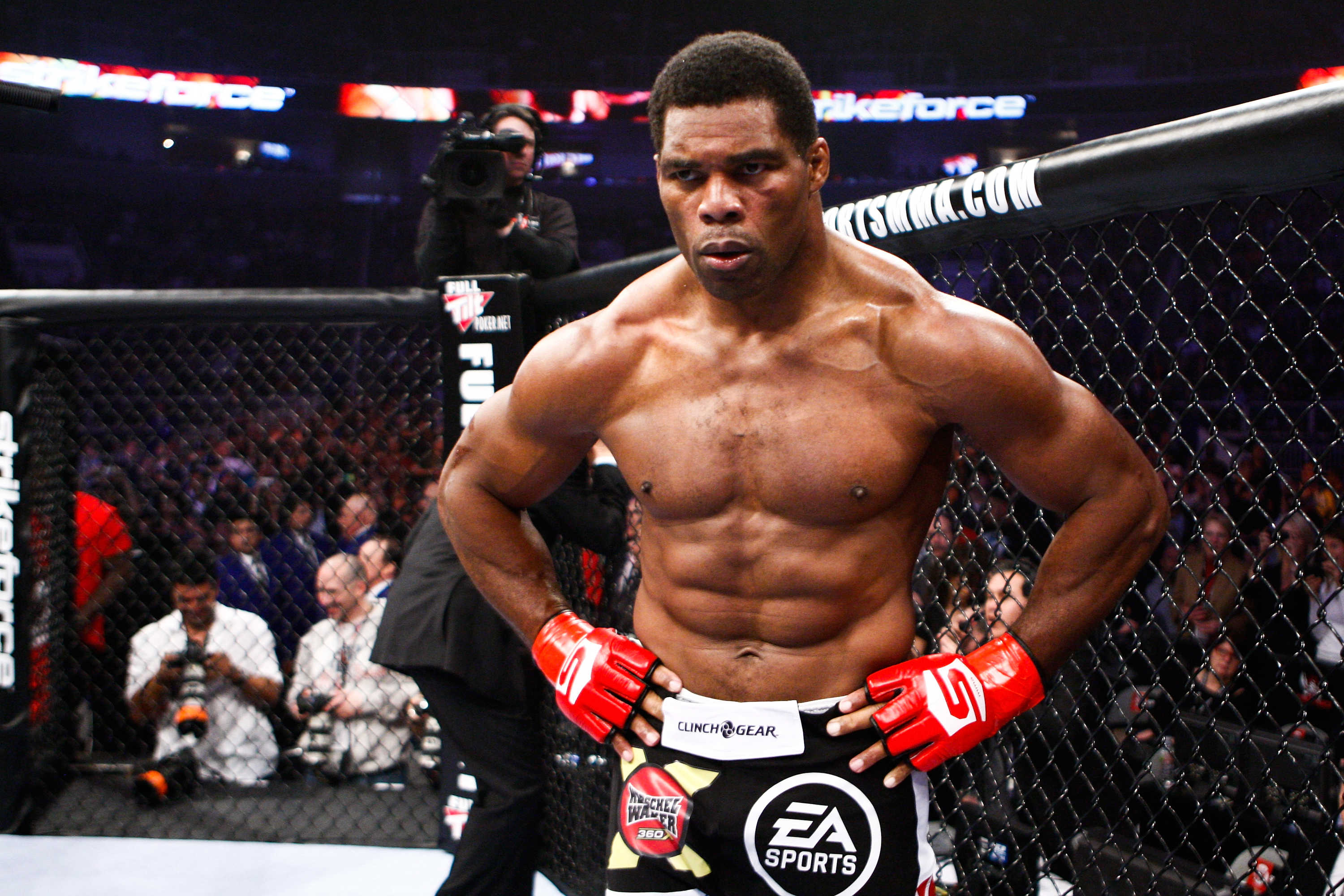SAN JOSE, CA - JANUARY 29: Herschel Walker celebrates his TKO victory over Scott Carson at the Strikeforce: Diaz vs. Cyborg event at the HP Pavilion on January 29, 2011 in San Jose, California. (Photo by Esther Lin/Zuffa LLC/Zuffa LLC via Getty Images)