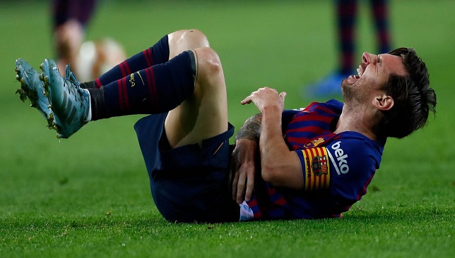 Lionel-Messi-injured-during-Barcelona-match-against-Sevilla-and-leaves-the-pitch-holding-his-arm