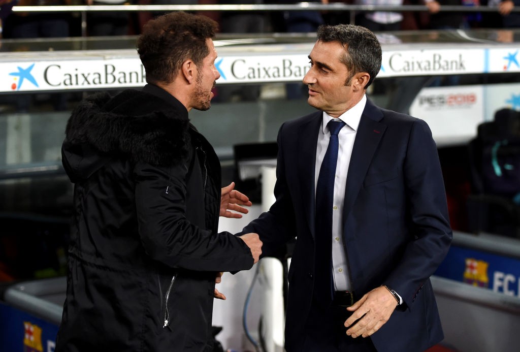 BARCELONA, SPAIN - APRIL 06: Diego Simeone, Manager of Atletico Madrid shakes hands with Ernesto Valverde, Manager of Barcelona prior to the La Liga match between FC Barcelona and Club Atletico de Madrid at Camp Nou on April 06, 2019 in Barcelona, Spain. (Photo by Alex Caparros/Getty Images)