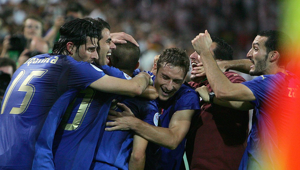 Italian players celebrate at the end of
